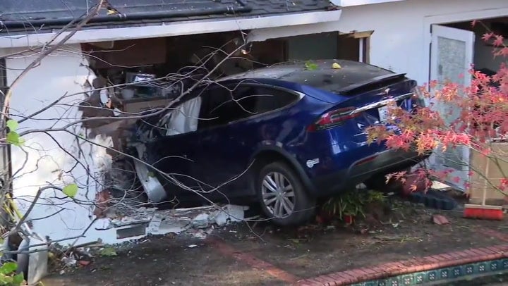 Firefighters on scene after Tesla crashes into family s kitchen News